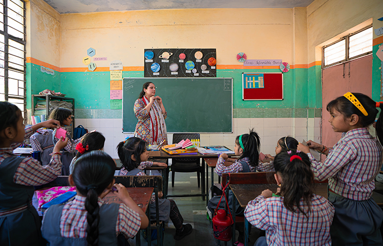 Teacher leading a classroom lesson