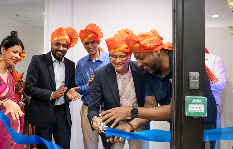 Indegene colleagues at a ribbon-cutting celebration